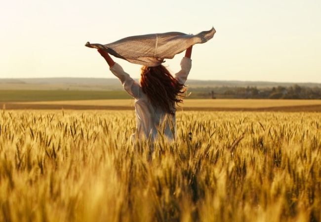 Back of a Woman in a wheat field 